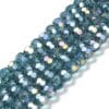 8mm faceted crystal round bead in a vibrant transparent teal colour with white shimmers from the light.