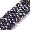 8mm faceted crystal round bead in a mysterious transparent navy blue colour with white shimmers from the light.