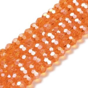 8mm faceted crystal round bead in a vibrant transparent orange colour with white shimmers from the light.