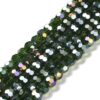 8mm faceted crystal round bead in a vibrant transparent green colour with white shimmers from the light.