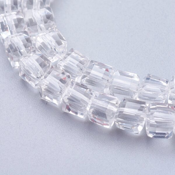 Strand of 4mm Glass Cube's in Clear, the faceted edges of the glass cubes allows the light to shimmer.