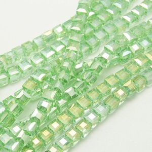 Strand of 4mm Glass Cubes in Green AB, the aurora borealis finish gives them a rainbow like shimmer in the light.