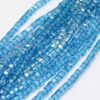 Strand of 4mm Glass Cube's in Light Blue AB, the aurora borealis finish gives them a rainbow like shimmer in the light.