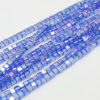 Strand of 4mm Glass Cube's in Blue AB, the aurora borealis finish gives them a rainbow like shimmer in the light.