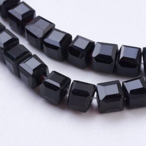 Strand of 4mm Glass Cube's in Black, the faceted edges of the glass cubes allows the light to shimmer.