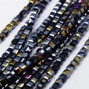 Strand of 4mm Glass Cube's in Black AB, the aurora borealis finish gives them a rainbow like shimmer in the light.