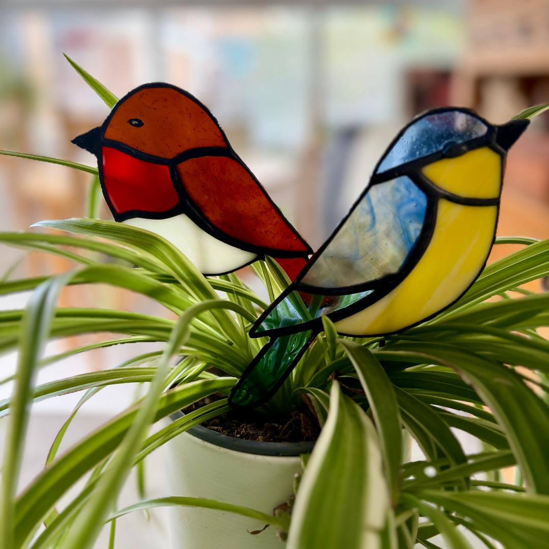 Handmade stained glass Blue Tit and Robin bird plant stakes for decorating indoor houseplants