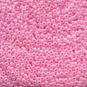 Pink seed beads in 25g bags.