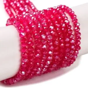 Fuchsia Crystal Rondelle beads with an Aurora Borealis finish. gives them a colourful glimmer in the light.