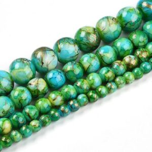 Marbled Glass Beads - Emerald Glimmer. The beads come in 4 sizes as shown in the picture and are a mixture of white and green with golden streaks throughout.