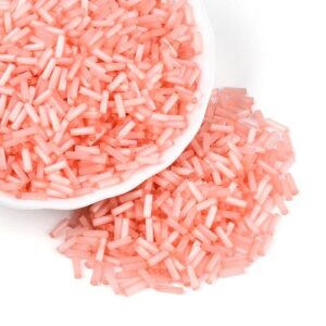 6mm Glass Bugle Beads - Salmon. These tubular beads have a hole passing through the length of the bead and are a shade of pastel.