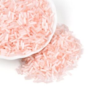 6mm Glass Bugle Beads - Misty Rose. These tubular beads have a hole passing through the length of the bead and are a shade of pastel.