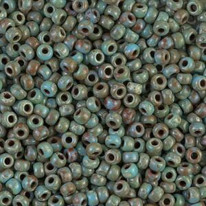 Close up detailed view of Miyuki matte glass seed beads in seafoam green with Picasso coating. Both sizes have the same finish.