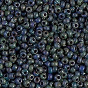 Detailed view of Miyuki matte glass seed beads in Montana blue with Picasso glaze.
