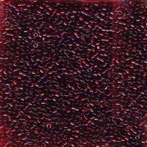 Close-up of Miyuki Delica DB1751 Red Lined Topaz seed beads with a rich red glow