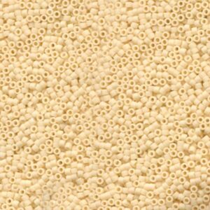 Close-up of Miyuki Delica DB762 Matte Opaque Cream seed beads in a soft warm neutral shade