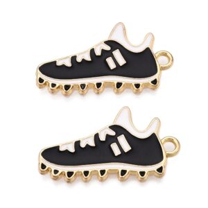 Black and white enamel football boot charms with gold trim and hanging loop.