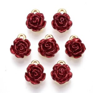 Deep red enamel rose charms with gold hanging loops, shown in a group.