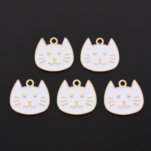 White enamel cat head charms with gold-tone outlines, facial details and top loops for jewellery making.