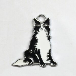 Black and white enamel collie dog charm with silver-tone edging and a top loop for jewellery making.