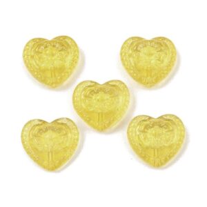 Six Yellowembossed floral heart-shaped glass beads for jewellery making, measuring approximately 16mm x 18mm.