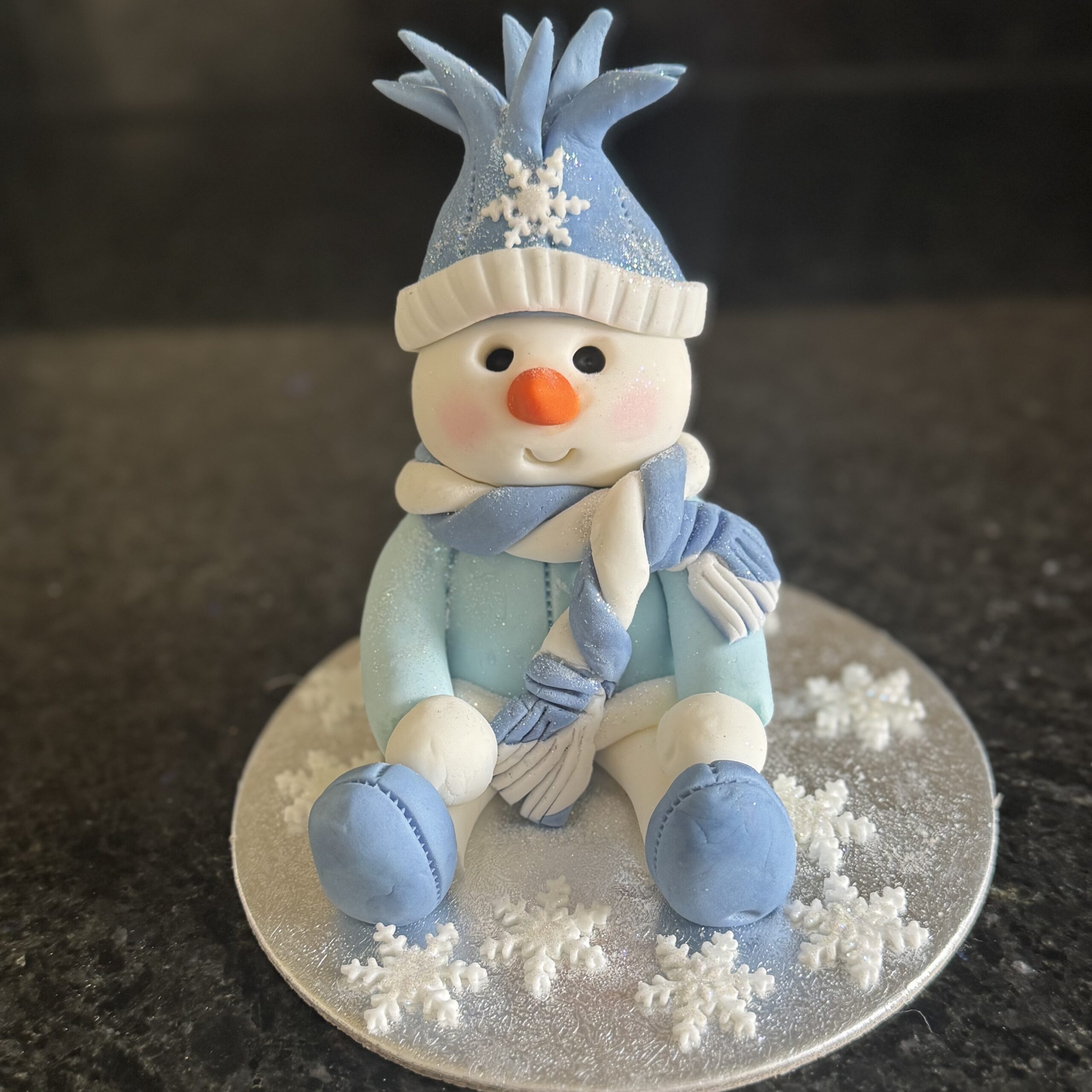 Handmade snowman Christmas cake topper created in sugarcraft workshop at Riverside Beads & Crafts