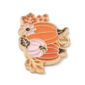 Pumpkin Patch Charm with three pumpkins, flowers and leaves in warm autumn colours from Riverside Beads.